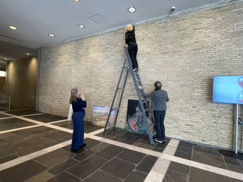 Setting up the Stigma Damages exhibit, photo by Kate Huber