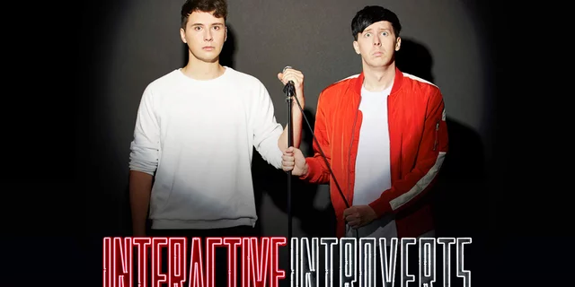 Dan and Phil posing for their live show "Interactive Introverts", looking shocked