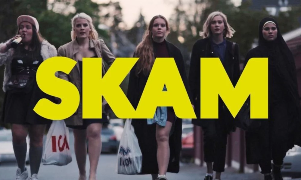 Five of the main characters of Skam walking, with yellow text saying SKAM in front of them.