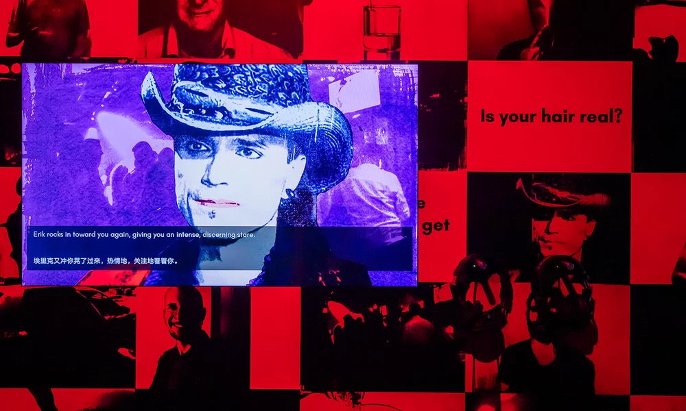 Museum exhibit of Angela Washko's The Game: The Game dating simulator