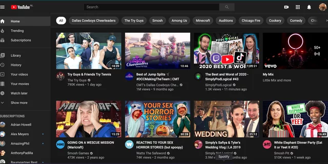 The YouTube home page with recommended videos. The YouTube page is in dark mode